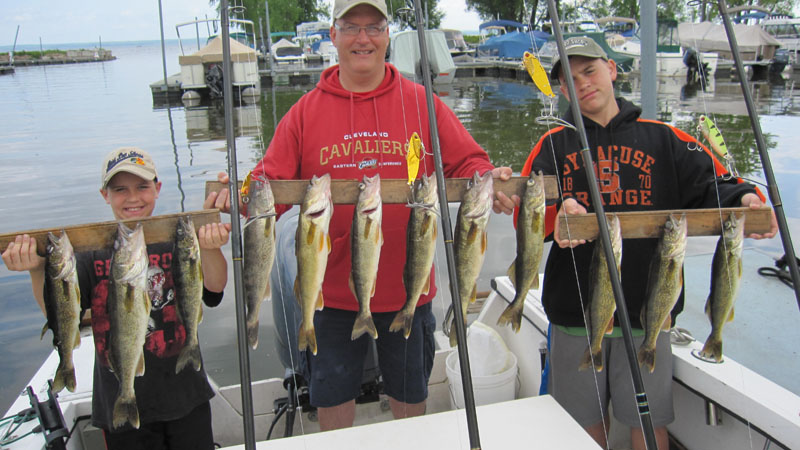 Zach, Bruce and Isaac Havens with fish caught during kids fishing charter in 2012
