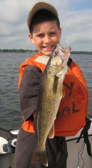 Zach Havens featured with fish caught during kids fishing charter in 2012